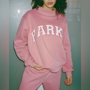 NWT Parke Valentine’s Day Varsity Mockneck in Bubblegum + White in a size L/XL